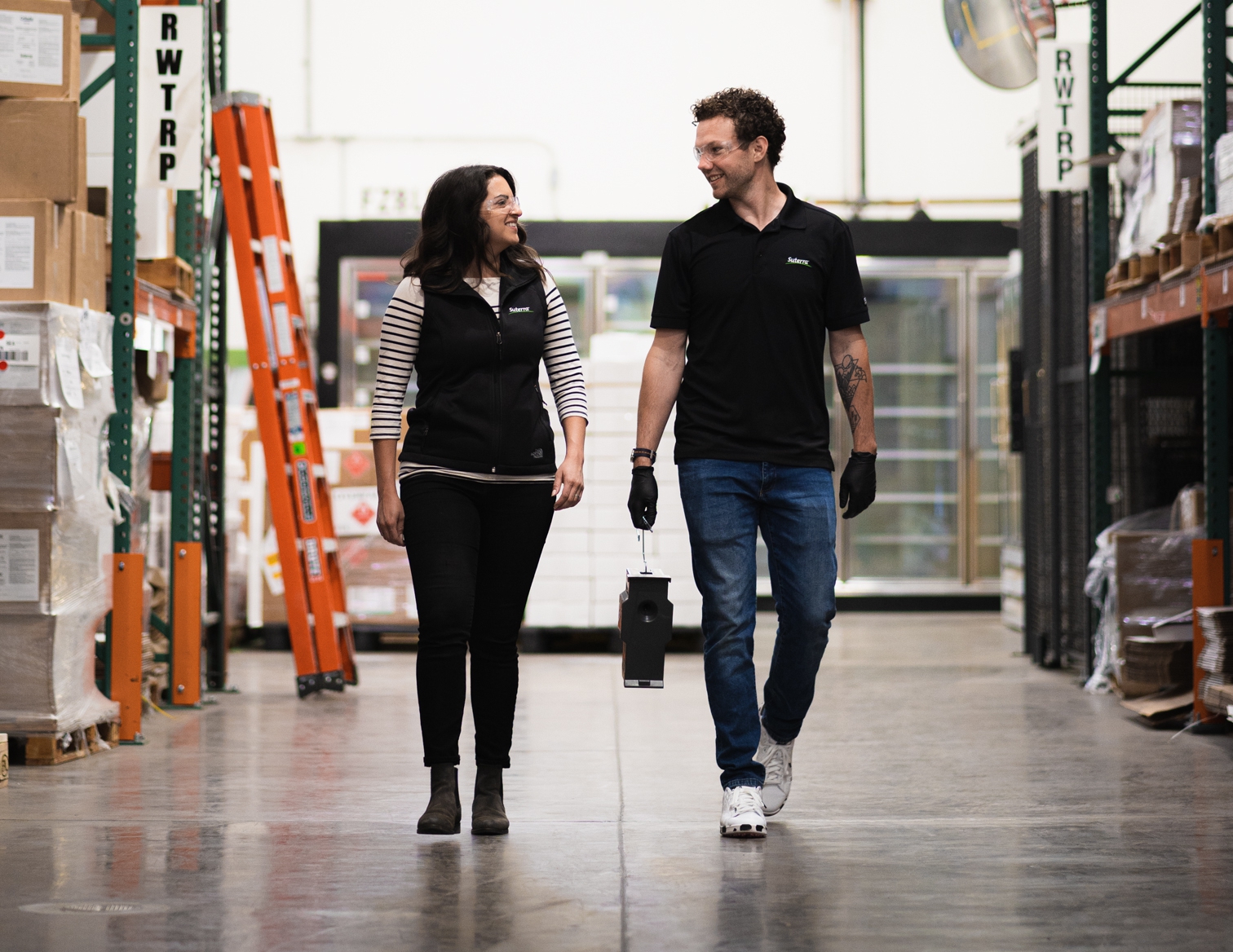 Suterra employees walk through a commercial stored product facility.