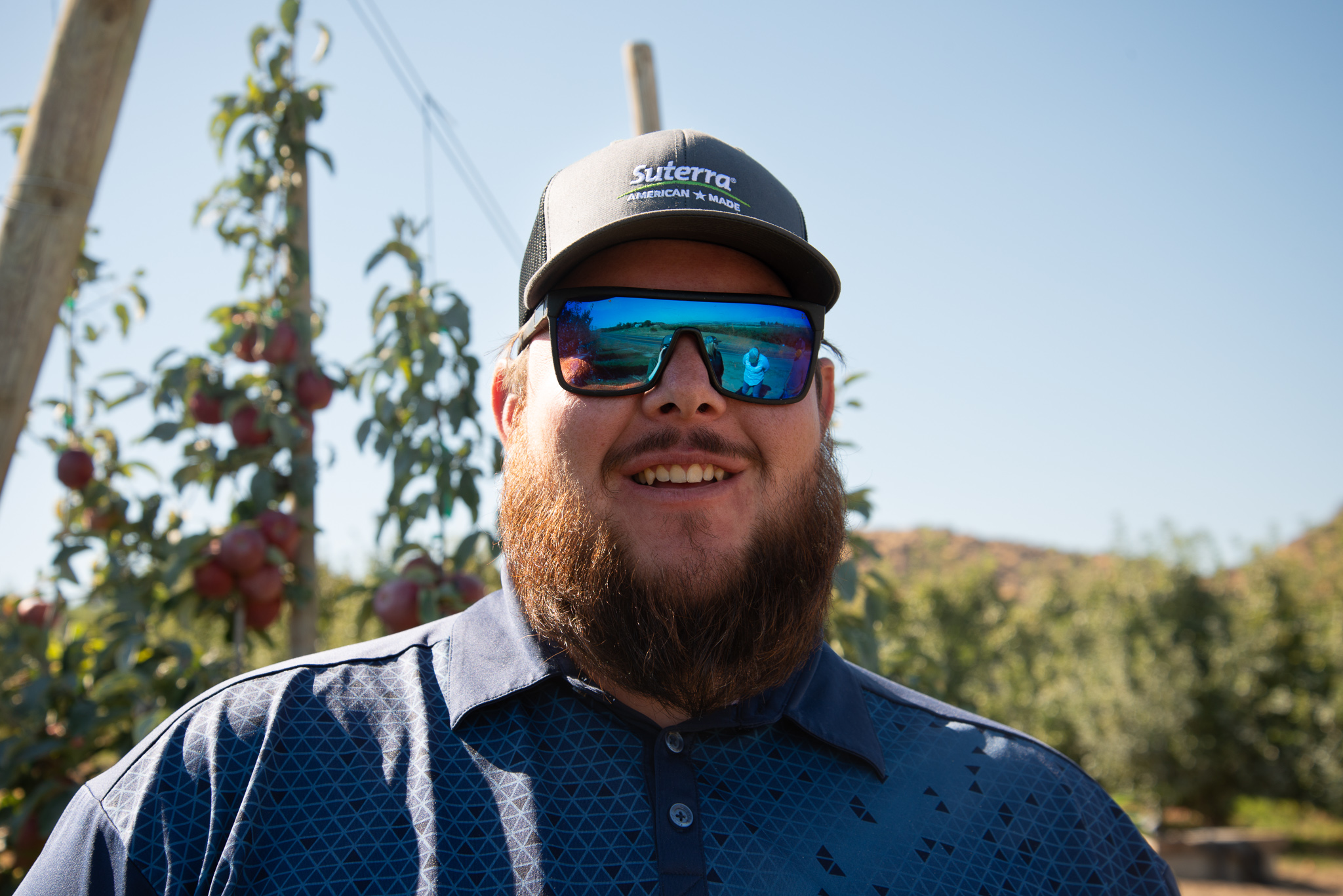 Suterra field team member smiling with sunglasses.